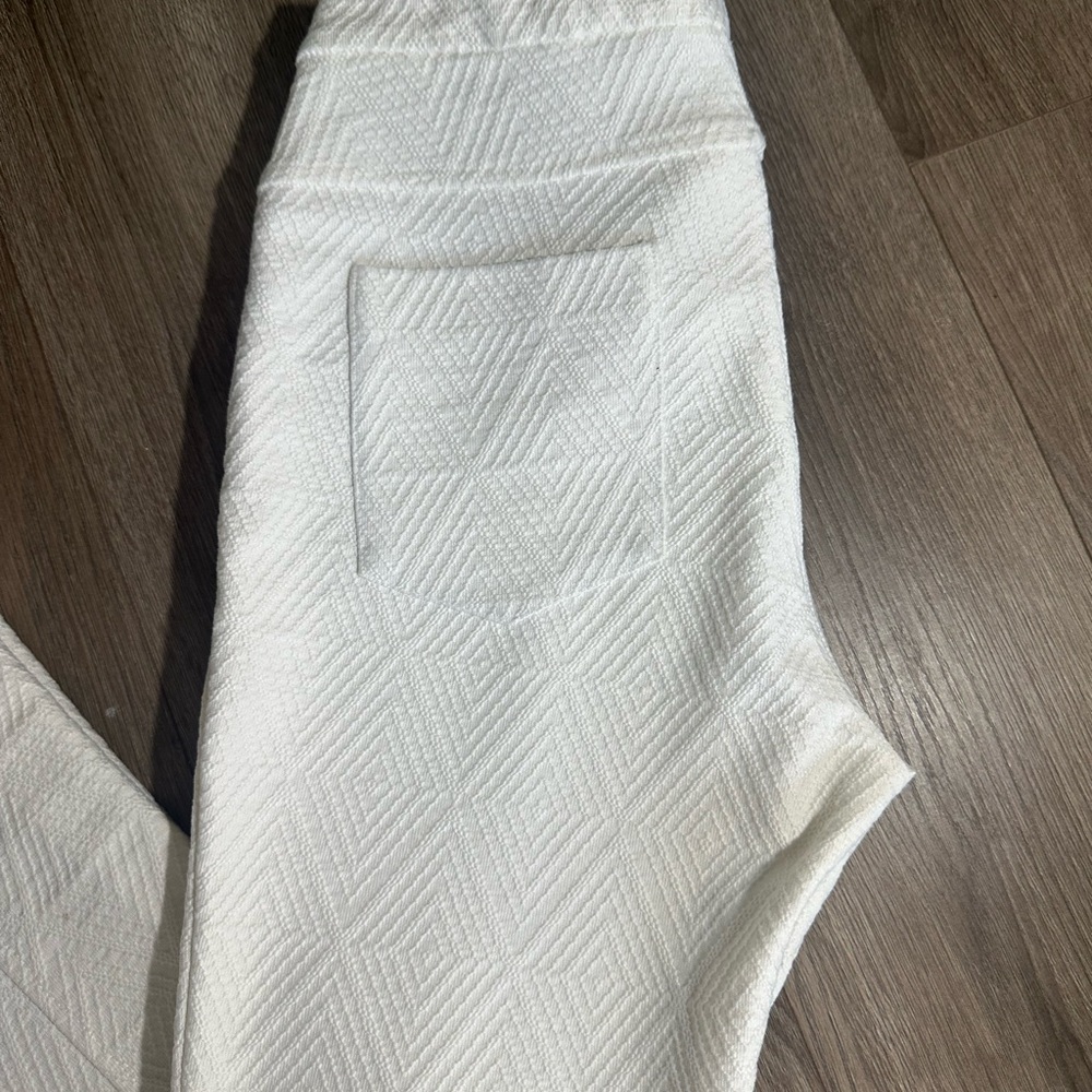 White Textured Boot-Cut Bell Bottom Flare Pants with Subtle Pattern - Picture 4 of 15